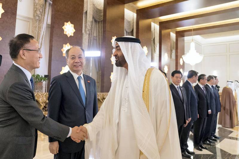 ABU DHABI, UNITED ARAB EMIRATES - July 19, 2018: HH Sheikh Mohamed bin Zayed Al Nahyan, Crown Prince of Abu Dhabi and Deputy Supreme Commander of the UAE Armed Forces (C) greets a member of the delegation accompanying HE Xi Jinping, President of China (not shown), during a reception held at the Presidential Airport.

( Mohamed Al Hammadi / Crown Prince Court - Abu Dhabi )
---