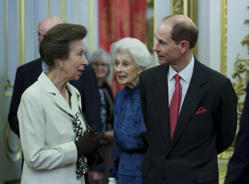 Princess Royal Anne and Prince Edward chat at the reception. AP