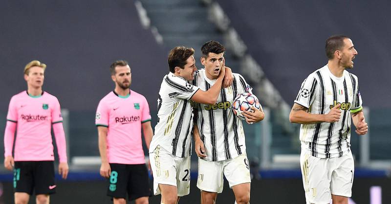 Juventus players Federico Chiesa and Alvaro Morata react after Morata scored, although the goal was ruled out by VAR. EPA