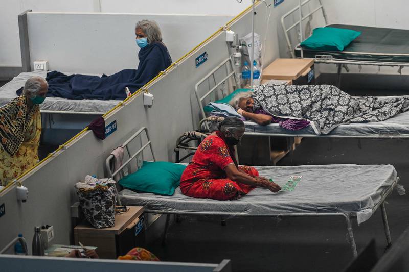 Patients rest inside a Covid-19 isolation centre in Navi Mumbai, India. AFP
