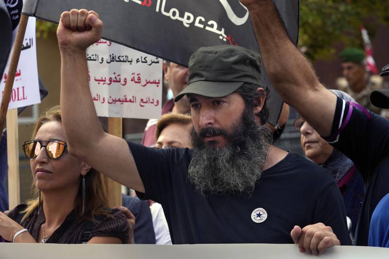 Bassam Al Sheikh Hussein joins a protest near Lebanon's parliament in Beirut against a capital controls draft law that protesters say will unfairly penalise depositors and protect Lebanon’s ruling class. AP