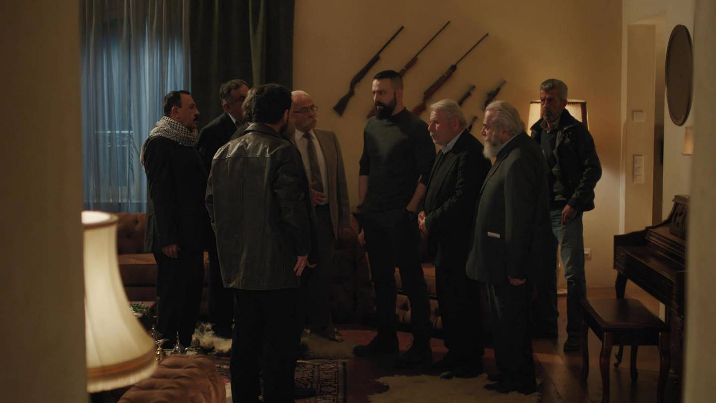 A still image from season two showing the predominantly male cast 