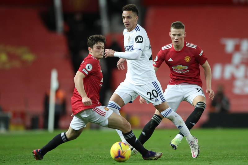 Rodrigo of Leeds in action against Daniel James and Scott McTominay of Manchester United. EPA