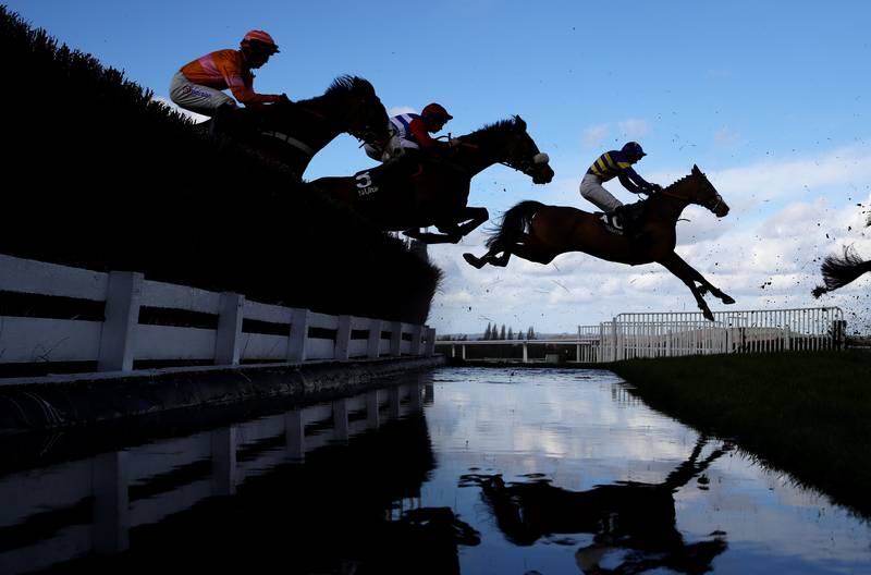 The Cheltenham Festival was underway on Tuesday, with runners taking the water jump during the Ultima Handicap Chase. Getty 