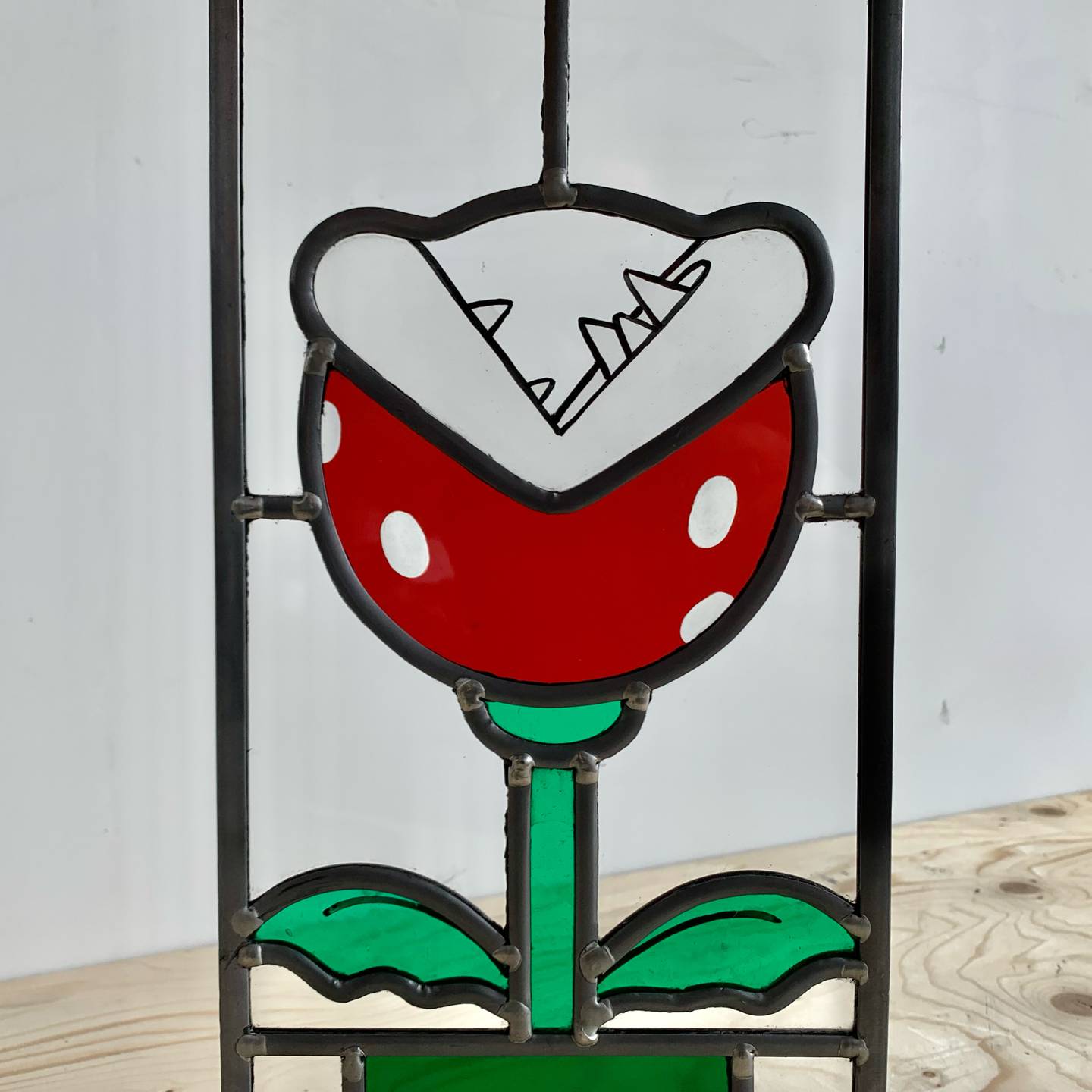Dutch artist Arjan Boeve's rendition of the flower from Nintendo's 'Super Mario' video games, made from stained glass. Courtesy Arjan Boeve