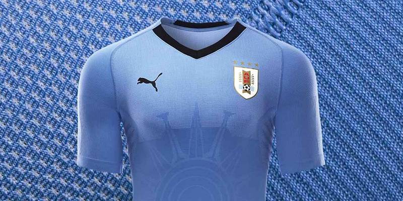 7 Uruguay ||
The look: Uruguay enters the World Cup sporting their classic silver-blue strip from Puma. It looks plain, but it's the little details that make this shirt pop: the Atlantic sun graphic, a hashtag, the black trim. || 
Would I wear it? I'm sadly not Edison Cavani