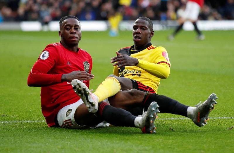 Manchester United's Aaron Wan-Bissaka in action with Watford's Abdoulaye Doucoure. Reuters
