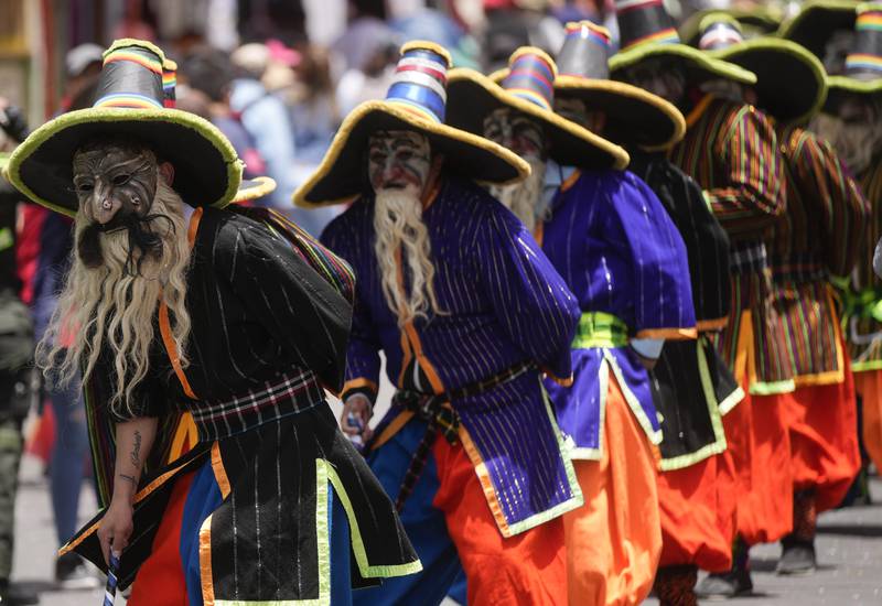Students perform in the traditional "Auqui Auqui" dance during the University Folk Fair, in La Paz, Bolivia. AP