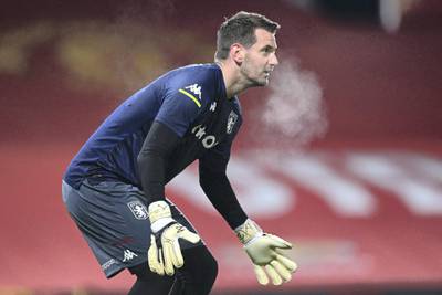 Aston Villa's English goalkeeper Tom Heaton warms up ahead of the English Premier League football match between Manchester United and Aston Villa at Old Trafford in Manchester, north west England, on January 1, 2021. (Photo by Laurence Griffiths / POOL / AFP) / RESTRICTED TO EDITORIAL USE. No use with unauthorized audio, video, data, fixture lists, club/league logos or 'live' services. Online in-match use limited to 120 images. An additional 40 images may be used in extra time. No video emulation. Social media in-match use limited to 120 images. An additional 40 images may be used in extra time. No use in betting publications, games or single club/league/player publications. / 