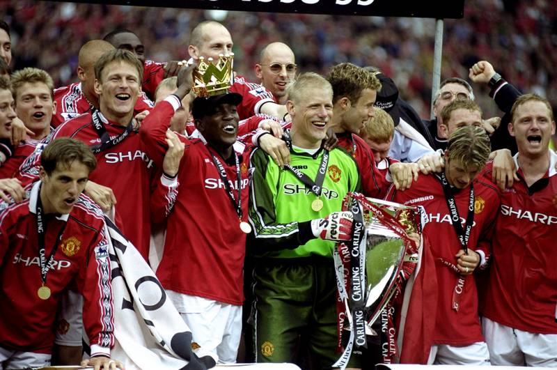 Manchester United players celebrate winning the title in the 1998-99 season with 79 points. Allsport