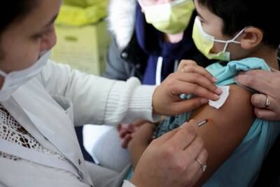 A child receives Covid-19 vaccination in Les Pavillons-sous-Bois, near France's capital city of Paris. Reuters
