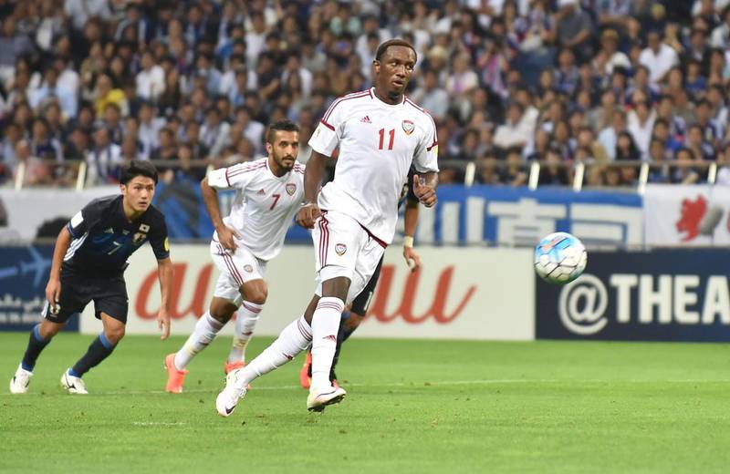 UAE forward Ahmed Khalil scores a penalty kick against Japan during their football match in the final round of Asian qualifiers for the 2018 World Cup at Saitama Stadium on September 1, 2016. Kazuhiro Nogi / AFP