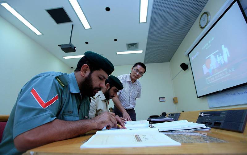 Dubai, United Arab Emirates-October 17, 2012;  ( Extreme Right )  Jichao Zhang teaches chinese language to the Dubai police at  the Dubai Police Academy in Dubai . (  Satish Kumar / The National ) For News