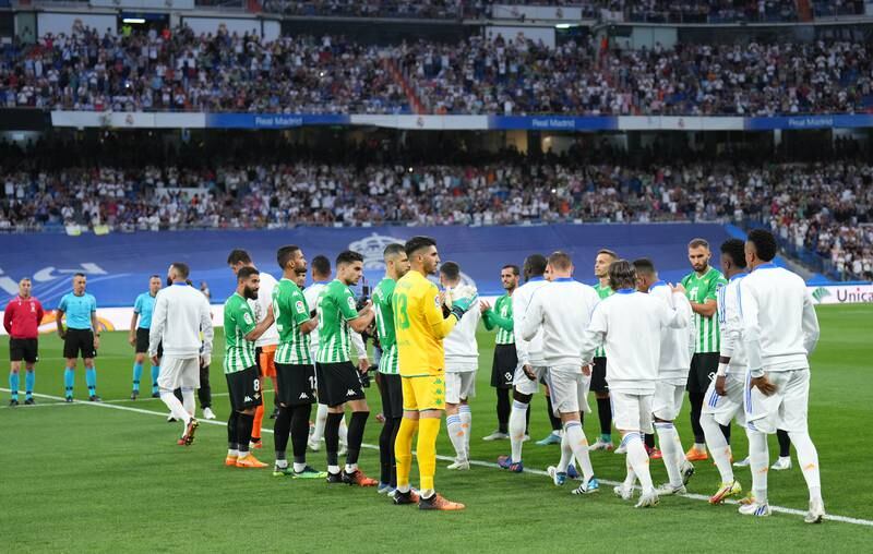 Real Madrid players are given a guard of honour by Real Betis before the game. Getty