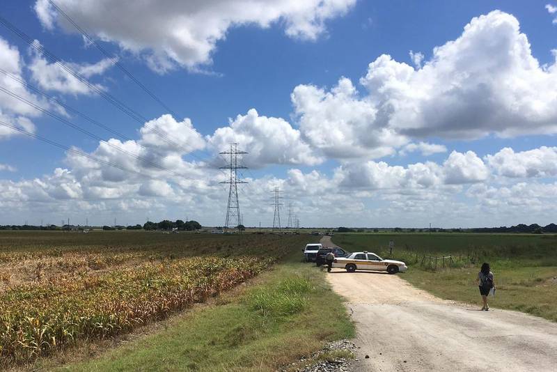 Police cars block access to the site where a hot air balloon crashed early on July 30, 2016, near Lockhart, Texas. James Vertuno/AP Photo