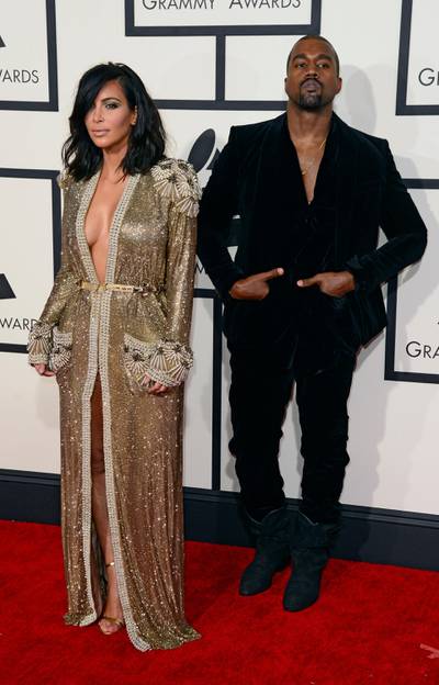 epa04611006 Kim Kardashian and Kanye West (R) arrive for the 57th annual Grammy Awards held at the Staples Center in Los Angeles, California, USA, 08 February 2015.  EPA/MICHAEL NELSON