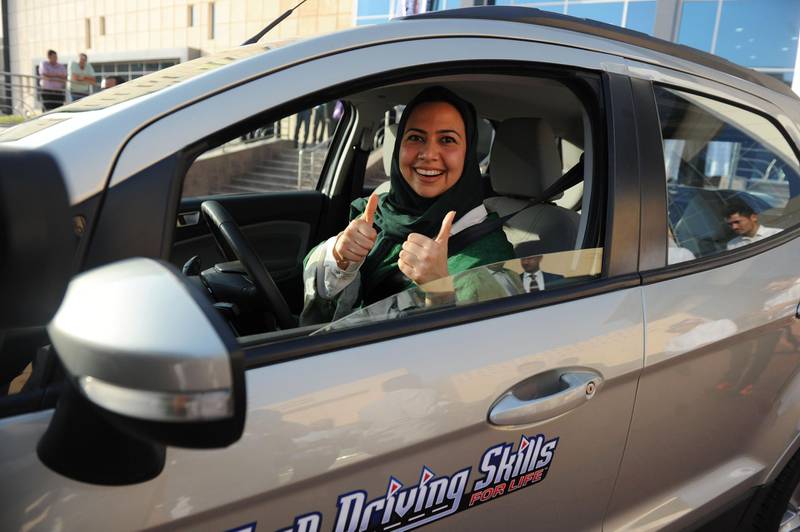A Saudi woman poses for a photo after having a driving lesson in Jeddah on March 7, 2018.
Saudi Arabia's historic decision in September 2017 to allow women to drive from June has been cheered inside the kingdom and abroad -- and comes after decades of resistance from female activists, many of whom were jailed for flouting the ban. / AFP PHOTO / Amer HILABI