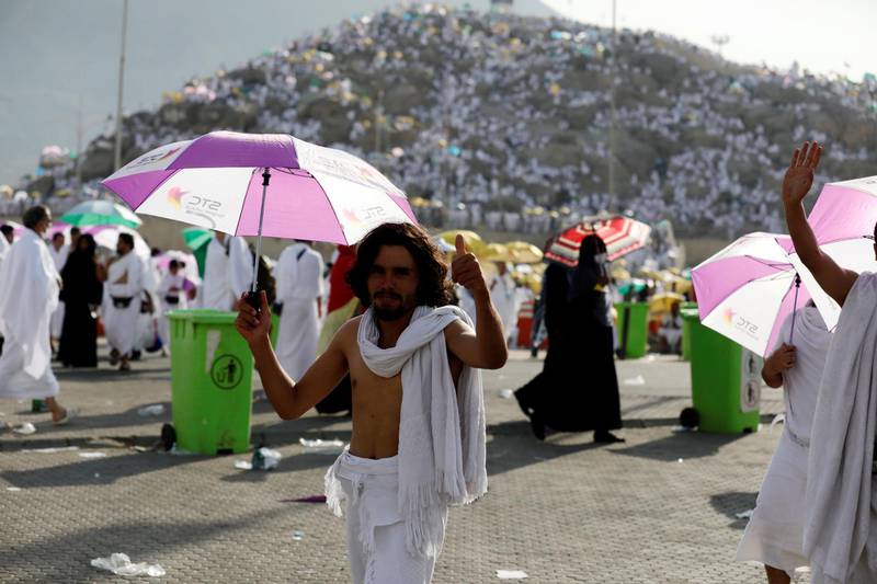 A man shades himself from the sun during his visit to Mount Arafat. Reuters