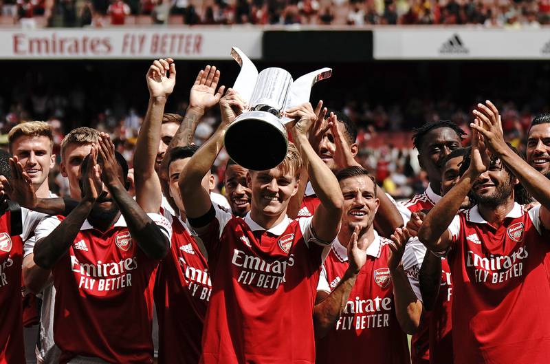 Arsenal's new captain Martin Odegaard lifts the trophy with team-mates after the 6-0 Emirates Cup final win against Sevilla at the Emirates Stadium on July 30, 2022. PA