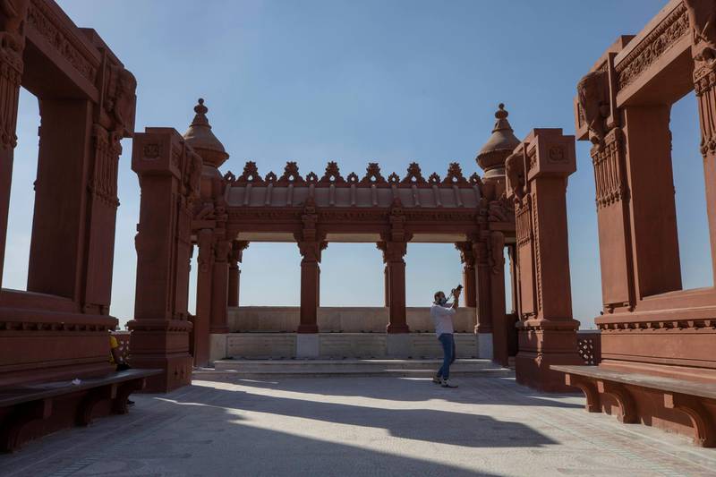 A man photographs the Baron Empain Palace, during the opening after its reconstruction in Heliopolis, Cairo, on June 30, 2020. AP
