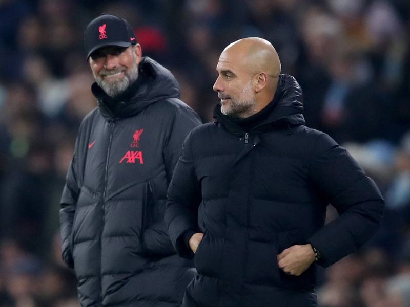 Manchester City manager Pep Guardiola, left, and Liverpool boss Jurgen Klopp go head-to-head again in the Premier League on Saturday. PA