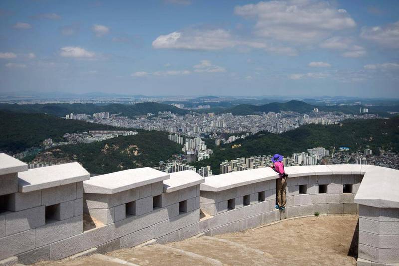 9th: Seoul. A hiker looks over the northern Seoul city skyline from a peak above the city. The MasterCard Index of Global Destination Cities ranks cities in terms of the number of their total international overnight visitor arrivals and the cross-border spending by these same visitors in the destination cities, and gives visitor and passenger growth forecasts for 2015. Public data is used in deriving the international overnight visitor arrivals and their cross-border spending in each of the 132 destination cities, using custom-made algorithms. It pays special attention to eliminate the hub effects for destination cities such as Singapore, Dubai, Amsterdam and Frankfurt. Ed Jones / AFP