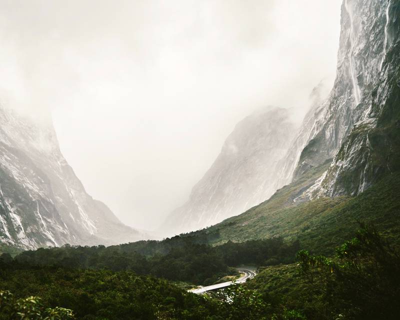 A misty mountain drive on Milford Road in New Zealand. Unsplash