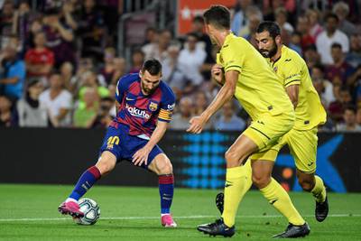 Barcelona's Argentine forward Lionel Messi vies with Villarreal's Spanish defender Raul Albiol. AFP