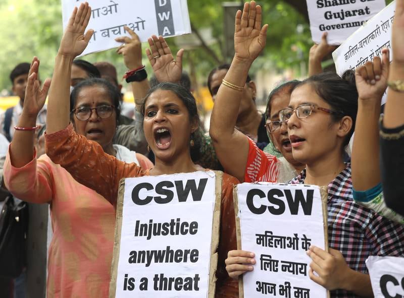 Women protest in New Delhi. The men were jailed in 2008 for the rape of Bilkis Bano, 21, and the murder of 14 members of her family, during sectarian riots in 2002. EPA 