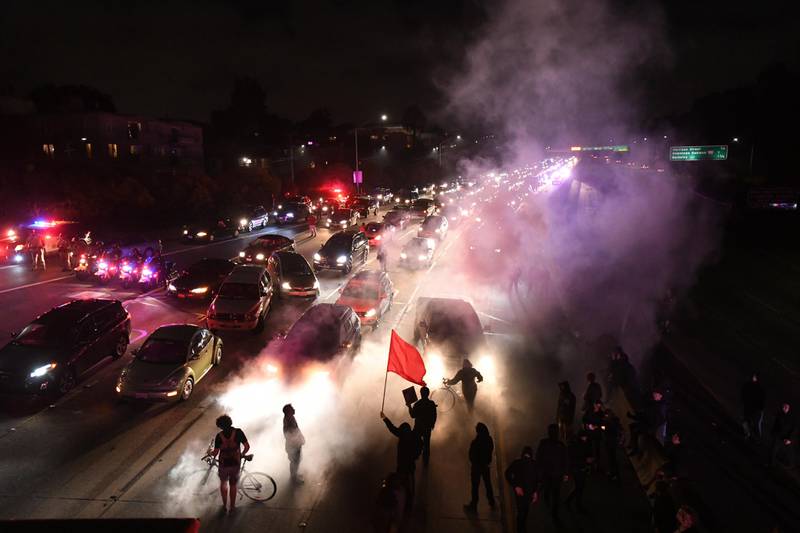 Protesters march along Interstate 580 in Oakland, California on Saturday. Protesters marched in Oakland to decry racism in the wake of deadly violence that erupted at a white nationalist demonstration in Virginia. Noah Berger / AP.