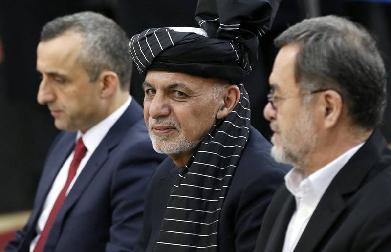 Afghanistan's President Ashraf Ghani, alongside his two vice president candidates Amrullah Saleh (L) and Sarwar Danish (R), arrives to register as a candidate for the upcoming presidential election at the Afghanistan's Independent Election Commission (IEC) in Kabul, Afghanistan January 20, 2019.REUTERS/Omar Sobhani