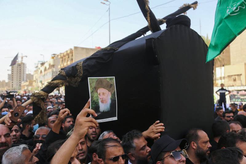 Iraqis carry the coffin of Grand Ayatollah Mohammed Saeed Al Hakim, one of Iraq's top four Shiite clerics, during his funeral procession in Karbala. Photo: AFP
