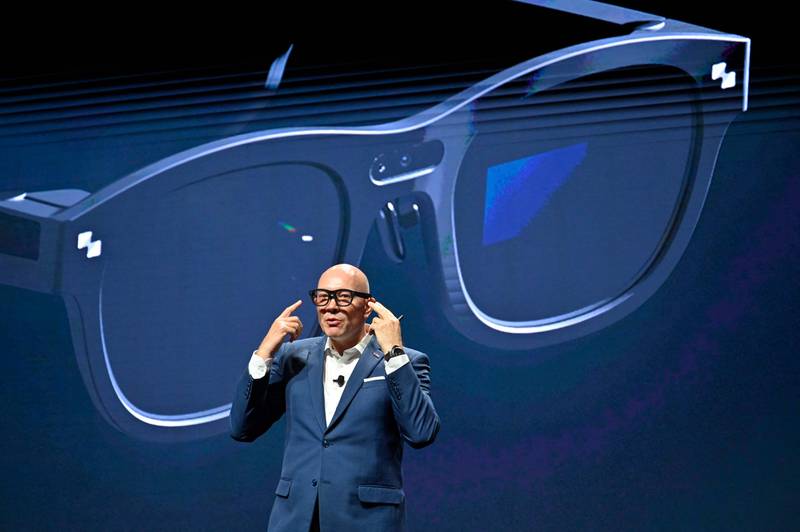 TCL Mobile chief marketing officer Stefan Streit wears a pair of TCL RayNeo X2 augmented reality glasses at CES. AFP