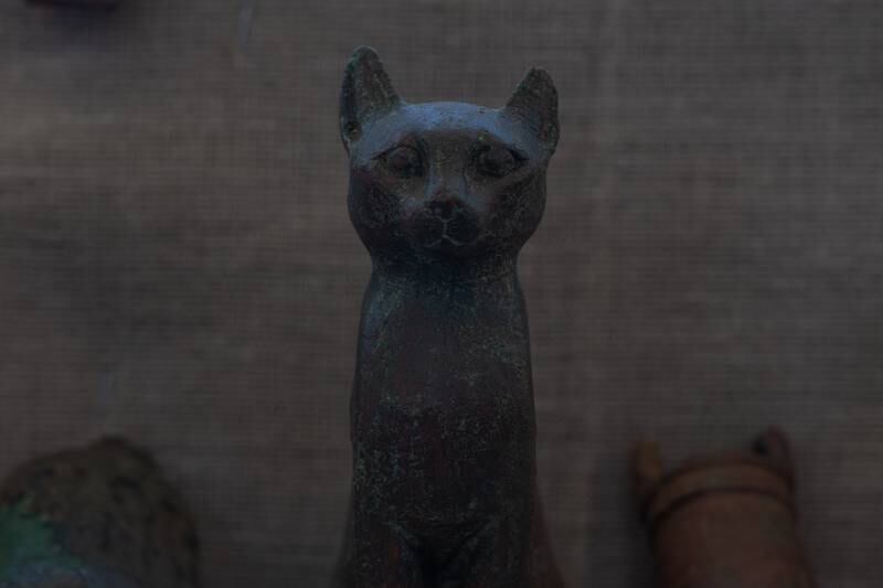 The small statues on display included deities such as Isis, Osiris and Bastet — the "protector" of the area in the form of a cat. Mahmoud Nasr / The National