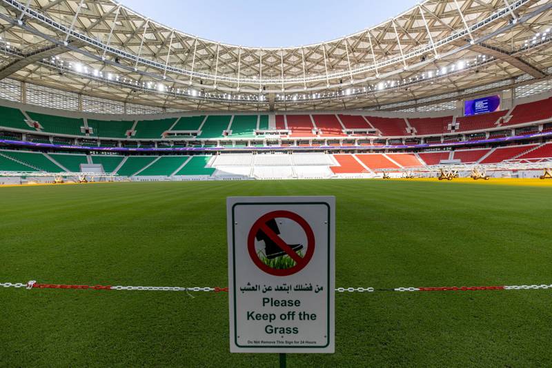 Pitch-side signage and barriers next to the pitch at the Al Thumama Stadium in Doha, Qatar. Bloomberg