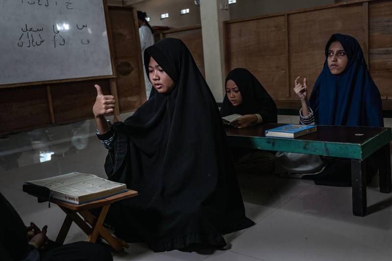 Indonesian deaf students read the Quran in Yogyakarta, Indonesia.  Getty Images