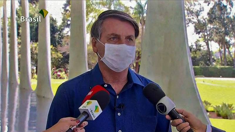 Brazilian President Jair Bolsonaro speaks to media at Planalto Palace in Brasilia. AFP