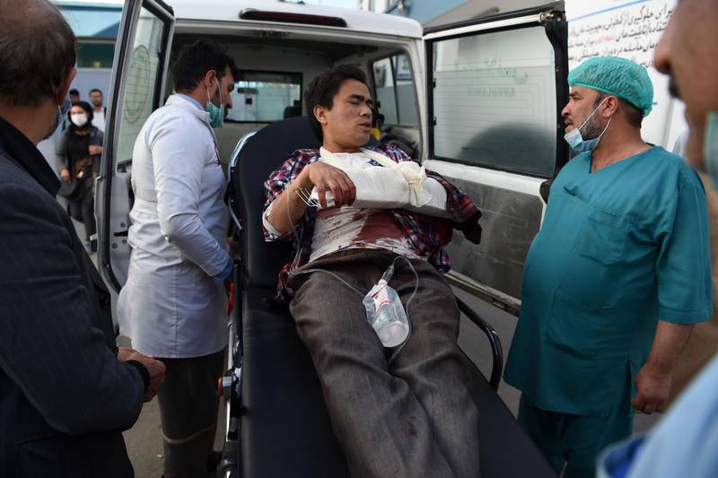 A man, wounded after gunmen stormed Kabul university, arrives in an ambulance to Isteqlal Hospital in Kabul.  Gunmen stormed Kabul university ahead of the opening of an Iranian book fair. AFP