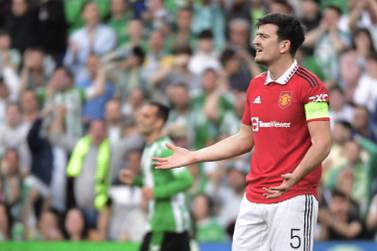 Manchester United's English defender Harry Maguire reacts during the UEFA Europa League last 16 second leg football match between Real Betis and Manchester United at the Benito Villamarin stadium in Seville on March 16, 2023.  (Photo by CRISTINA QUICLER  /  AFP)