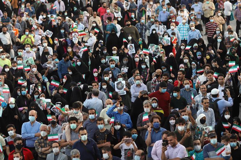 Supporters of Ebrahim Raisi gather to celebrate his presidential election victory in Tehran. He had the support of supreme leader Ayatollah Ali Khamenei and the backing of the powerful Guardian Council. Reuters