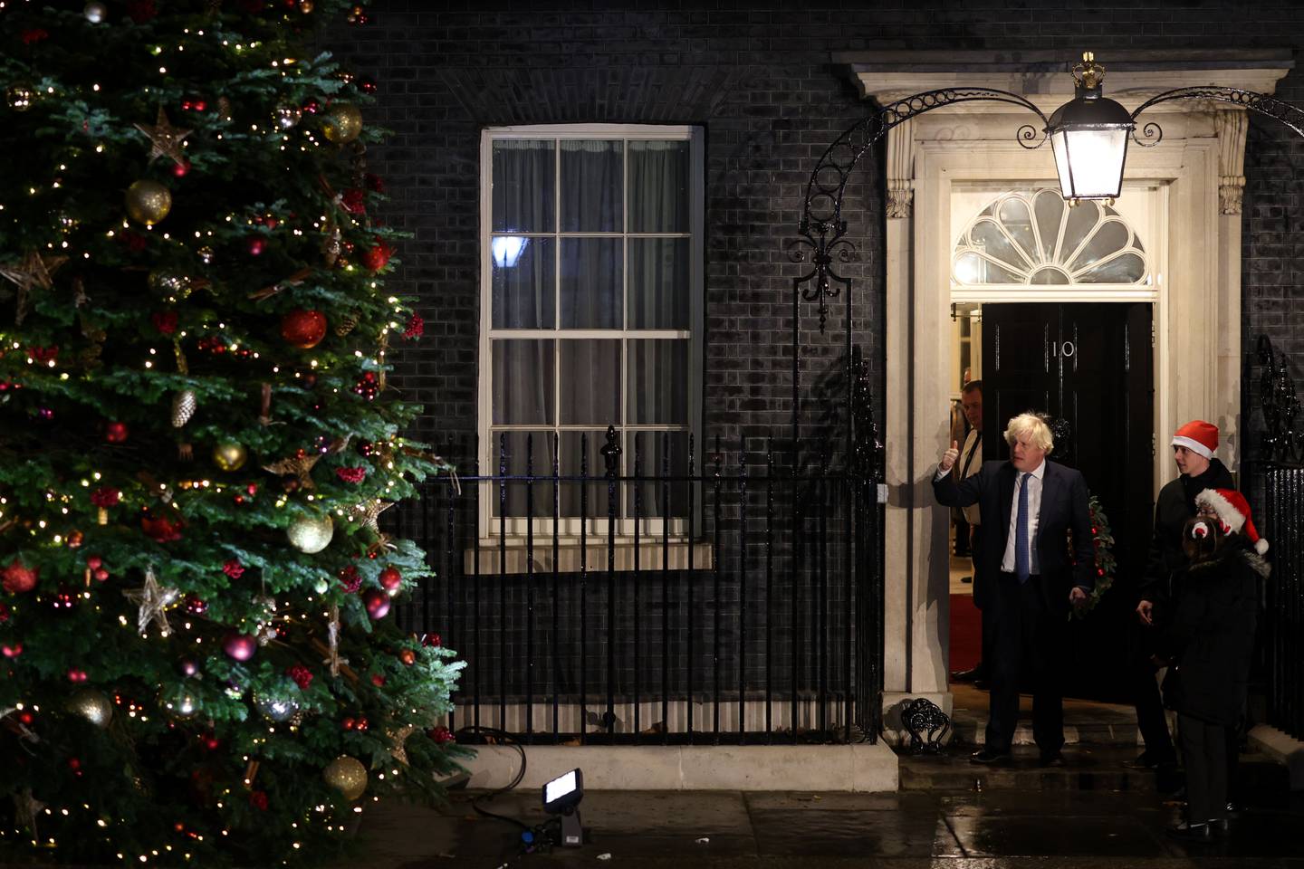 British Prime Minister Boris Johnson lights the Christmas tree in Downing Street in December 2021. Getty Images