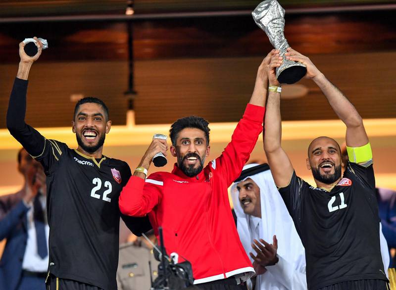 epa08055595 Goalkkepers Sayed Jaffer (R) and Hamed Al-Doseri (L) of Bahrain celebrate with the trophy after the 24th Arabian Gulf Cup final soccer match between Bahrain and Saudi Arabia at the Abdullah bin Khalifa Stadium in Doha, Qatar, 08 December 2019.  EPA/Noushad Thekkayil