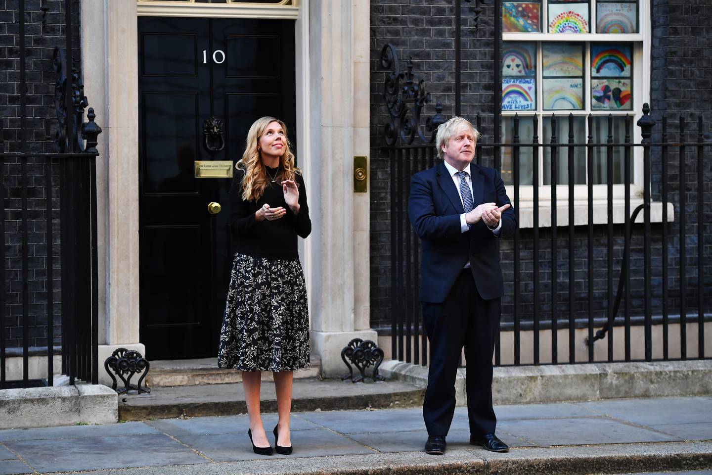 Boris Johnson and his wife Carrie outside No 10 Downing Street, which they will have to soon vacate. However, the British Prime Minister's future earnings will provide some compensation for his loss of power. Getty

