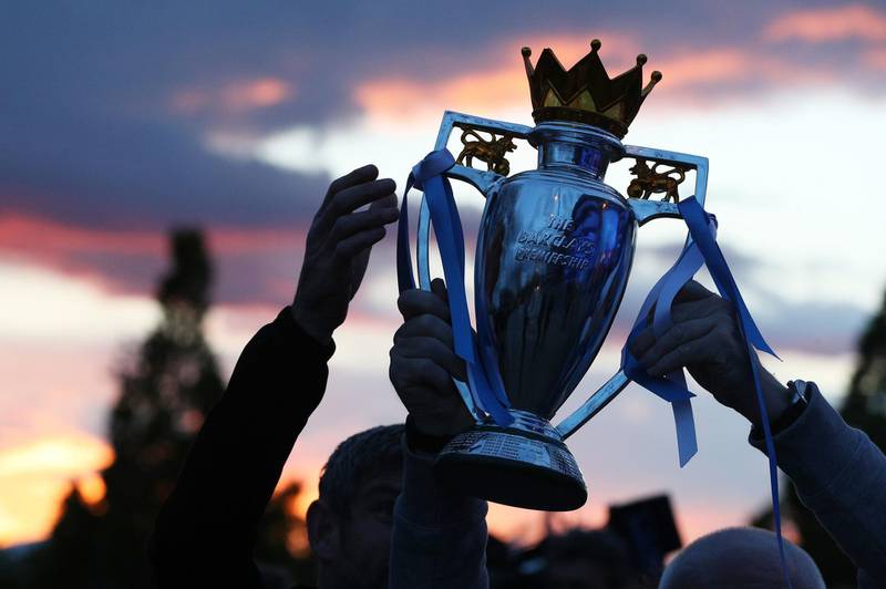 Fans celebrate at the Etihad Stadium after Manchester City were crowned Premier League champions. PA