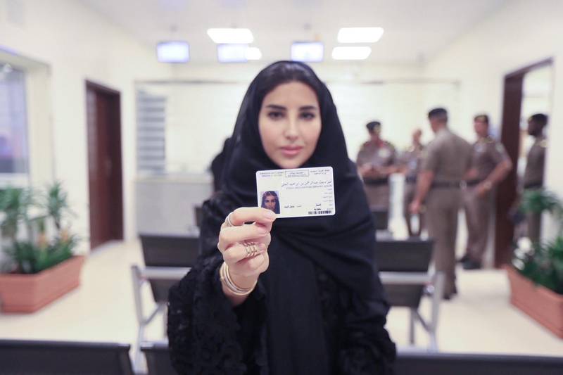 Esraa Albuti shows off her new driving licence issued by Saudi Arabia. CIC / Ministry of Media