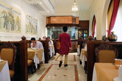 Diners enjoy a meal at India Palace restaurant in Abu Dhabi. The restaurant is among a host of family-run, traditional or long-standing restaurants in Abu Dhabi that now must compete with new fancy places in the changing F&B market in Abu Dhabi. Delores Johnson / The National /  April 4, 2017