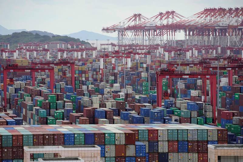 FILE PHOTO: Containers are seen at the Yangshan Deep-Water Port in Shanghai, China October 19, 2020. REUTERS/Aly Song/File Photo