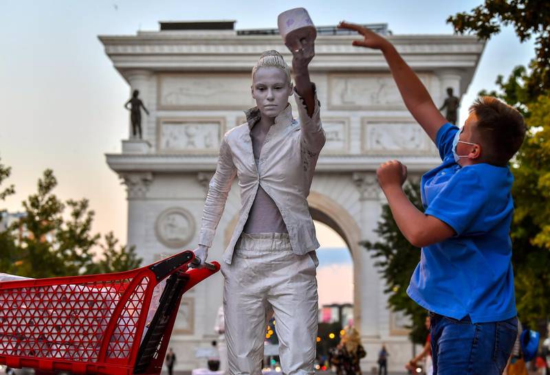 Statue Fest 2020 participants perform to raise awareness for people to respect the social distancing recommendation due to the coronavirus pandemic at the main square of Skopje, Republic of North Macedonia.  EPA