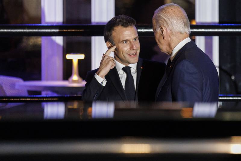 Mr Biden and Mr Macron depart the Fiola Mare restaurant in Washington. Bloomberg 