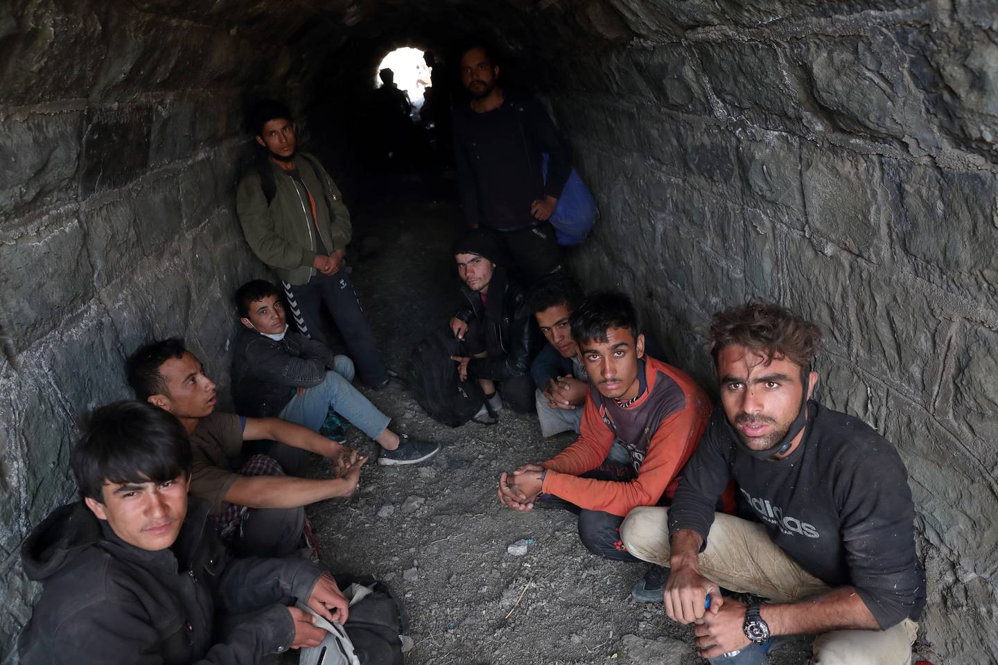 Afghan migrants hide from security forces in a tunnel near Tatvan in Bitlis province on August 23, after crossing illegally into Turkey from Iran. Reuters